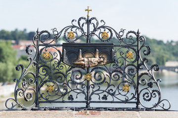 The place on the Charles bridge parapet where St. John of Nepomuk was thrown over the bridge.