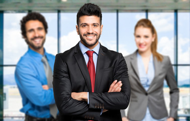 Three businesspeople welcoming you