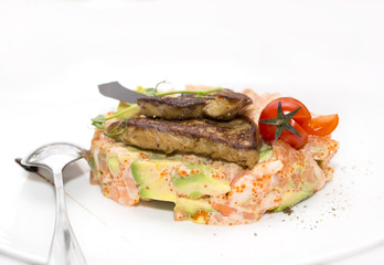 salad, fish and eggs decorated with greens and tomatoes