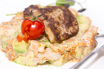 salad, fish and eggs decorated with greens and tomatoes