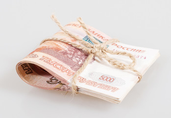 Pack of five thousandth Russian rubles, tied a rope isolated