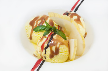 balls of ice cream decorated with mint on a white background in the restaurant