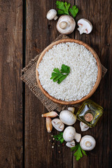 Ingredients for risotto: rice, mushroom, garlic, oil
