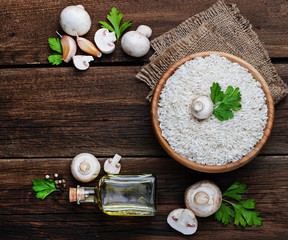 Ingredients for risotto: rice, mushroom, garlic, oil