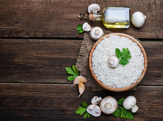 Ingredients for risotto: rice, mushroom, garlic, oil
