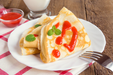 Pancakes with strawberry sauce
