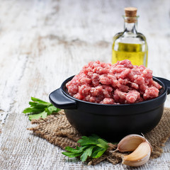 Raw minced meat with olive oil and garlic
