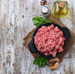 Raw minced meat with olive oil and garlic