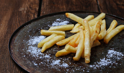 French fries in paper wrapper