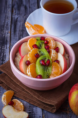 Bowl of oatmeal with fruits