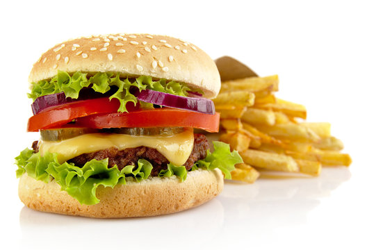 Big cheeseburger with french fries isolated on white background