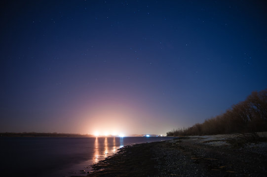 Night shore and barge lights