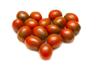 Heart of red tomato on white background