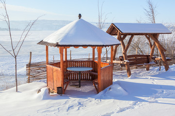 wooden gazebo in winter 