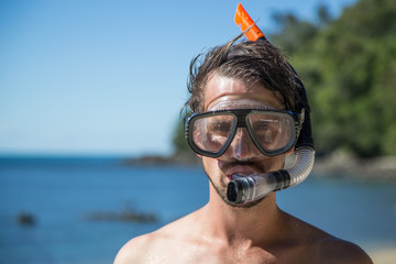 Young man with snorkeling gear