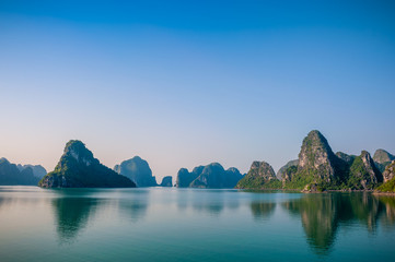 Ha long bay islands with reflections in the morning Vietnam
