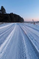 Fototapeta na wymiar Winter road in snow