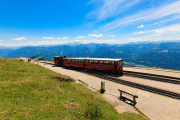 Steam train in a beautiful alpine landscape.