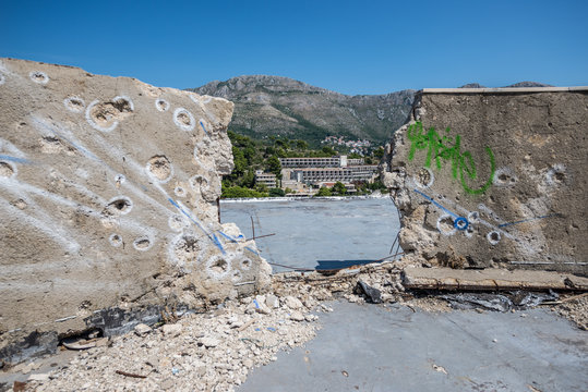 bullet holes on the roof of abandoned hotel in former Tourist Complex of Kupari village, Croatia