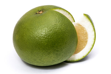 Sweet green grapefruit and cut piece isolated on white