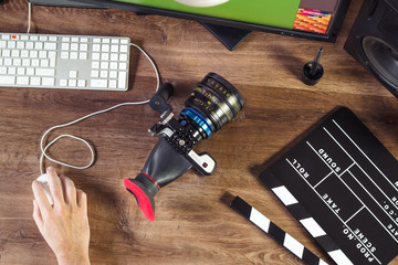 Desktop top shot of a modern Cinema Camera on stylish wooden workplace