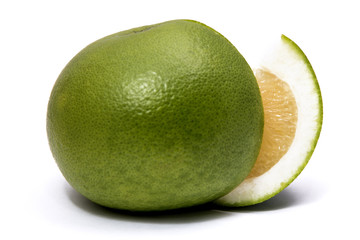 Sweet green grapefruit and cut piece isolated on white