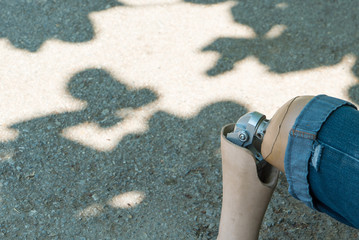 Close up of Artificial legs under tree shadow