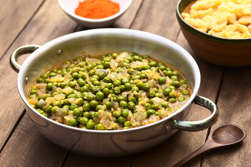 Hungarian pea stew made of onion and peas and seasoned with paprika and salt, served usually with Hungarian galuska or nokedli (homemade noodles) (Selective Focus, Focus into the middle of the stew)