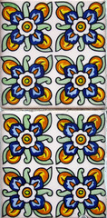 Detail of the traditional tiles from facade of old house in Valencia, Spain
