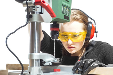 female carpenter and drilling machine.