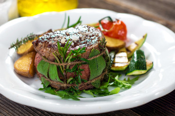 Grilled beef steak with herbs