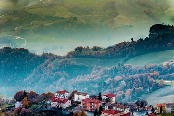 sunset on hilly village