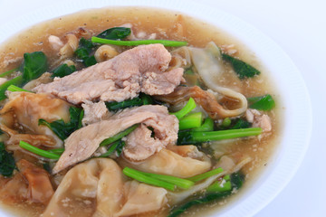 The Best Thai Dishes, Wide Rice Noodles Pork in Thick Gravy, Thai Noodles Topped with Pork: Chinese and Thai Style food called 