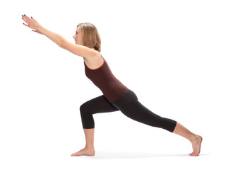 Young woman doing yoga on a white background