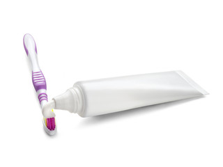 tube of toothpaste with a toothbrush  isolated on white backgrou