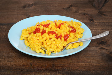 macaroni and cheese with ketchup and fork