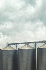 Grain silos on cloudy day