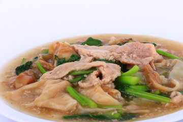 The Best Thai Dishes, Wide Rice Noodles Pork in Thick Gravy, Thai Noodles Topped with Pork: Chinese and Thai Style food called 