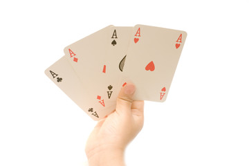 Hand holding four aces