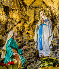 the Blessed Virgin Mary in the grotto at Lourdes - obrazy, fototapety, plakaty