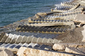 
destroyed stairs on the beach