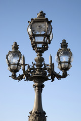 Fototapeta na wymiar Lamppost on Pont Alexandre III Bridge, Paris, France