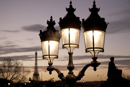 Fototapeta Eiffel Tower illuminated at night in Paris, France