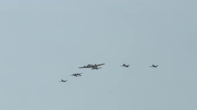 B-17 Flying Fortress leads a formation of World War II fighter planes, including a P-63 Kingcobra, a P-38 Lightning, and two P-51 Mustangs.  Recorded in 4K, ultra high definition. 