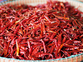 Dried red chili in the flat basket stall at market for sell