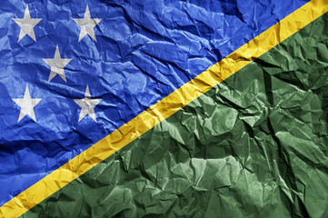 Solomon Islands flag painted on crumpled paper background