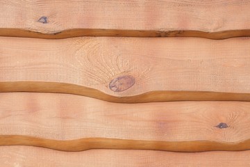 texture from the processed tree. a structure from wood. wooden wall. a fence from boards