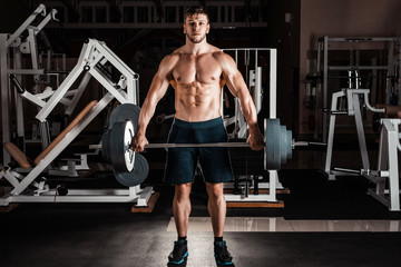 Fototapeta na wymiar Muscular Man in gym