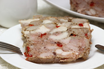 Terrine on plate made from pork and chicken meat