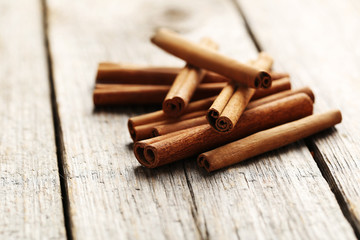 Cinnamon on a grey wooden background